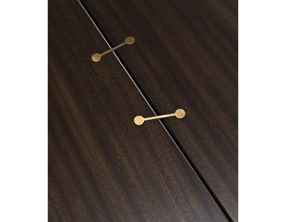 A close-up of a 10th Joint Wood Coffee Table shows two brass fasteners connecting two dark wood planks, highlighting the table's unique joinery detail