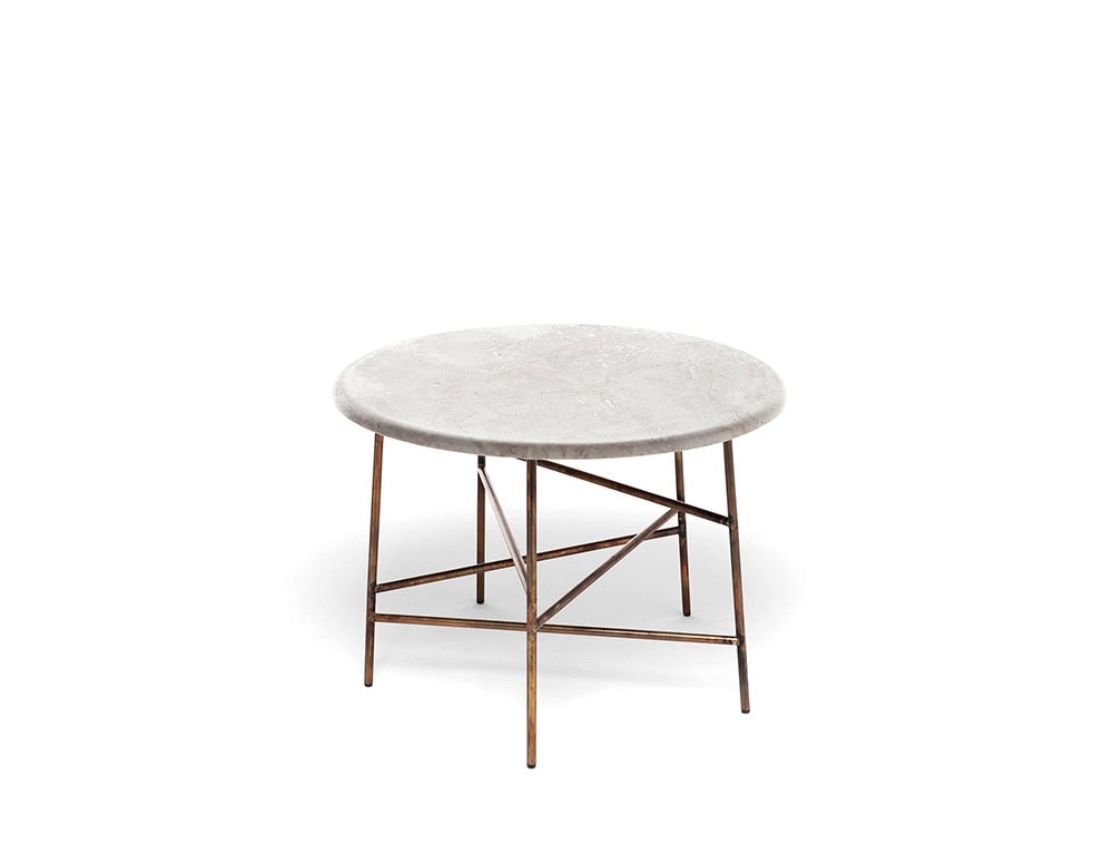 A 10th Star Coffee Table with a round, light-colored tabletop and a dark metal base with a starburst design is shown against a white background