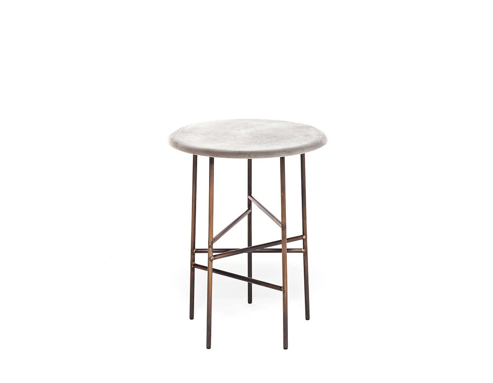 A 10th Star Side Table with a round, light-colored tabletop and a dark metal base with a starburst design is shown against a white background