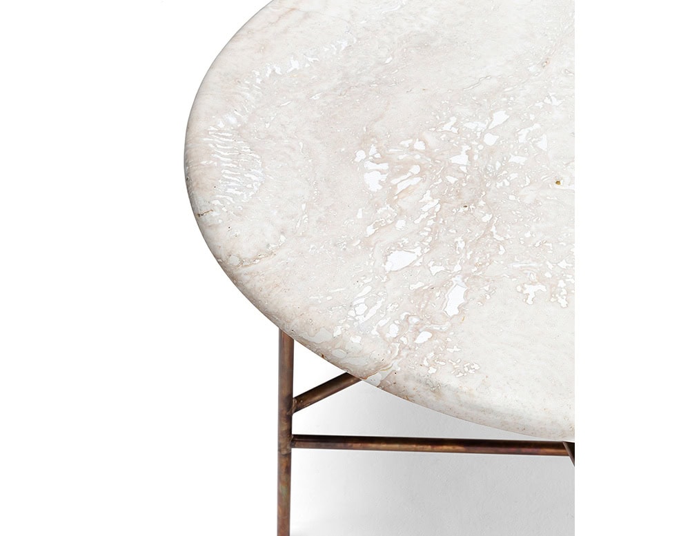 A close-up of a 10th Star Outdoor Coffee Table Stool shows a round, light-colored tabletop with a textured surface and a dark metal base against a white background