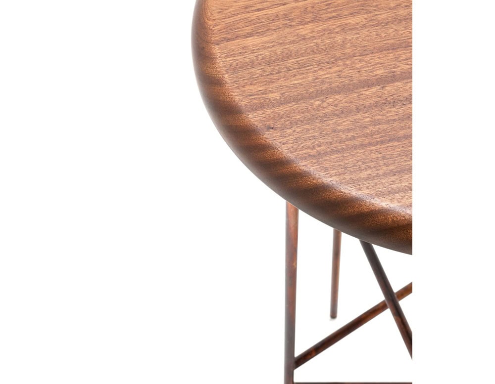 A 10th Star Outdoor Coffee Table Stool with a round, wood-like top and a dark metal base is shown against a white background; the base has a starburst design with four legs
