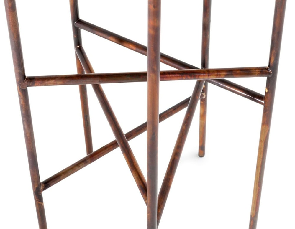 A close-up of a 10th Star Coffee Table shows a network of dark wood legs forming geometric shapes against a white background