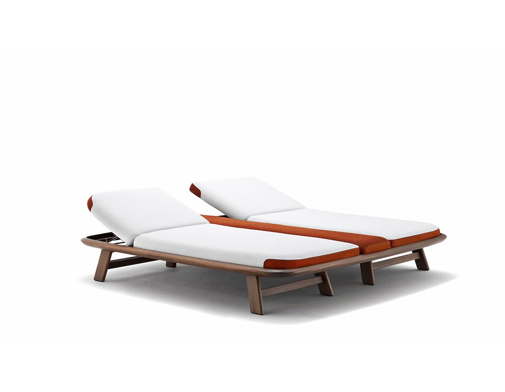 Two 10th Tellaro Sun Loungers with white cushions and light wood frames are placed side by side on a white background