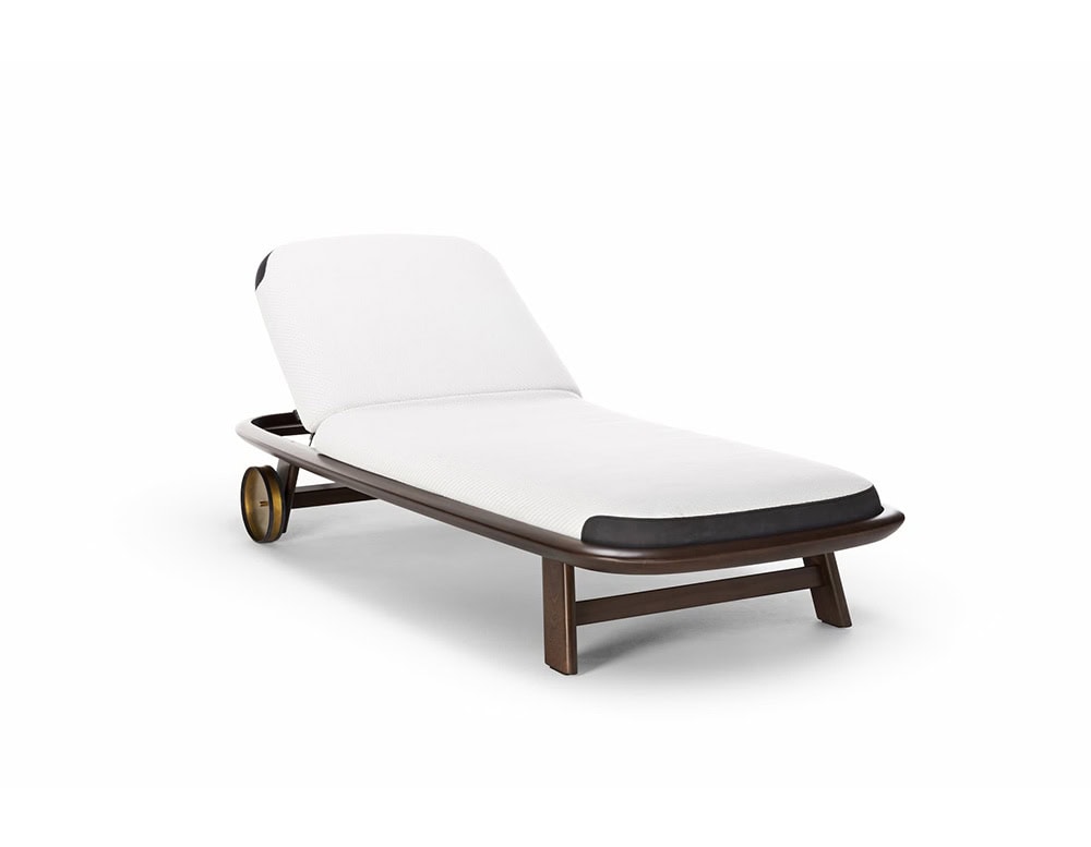 A white cushioned 10th Tellaro Sun Lounger with a dark brown wooden frame is angled on a white background, showing a wheel and adjustable back.