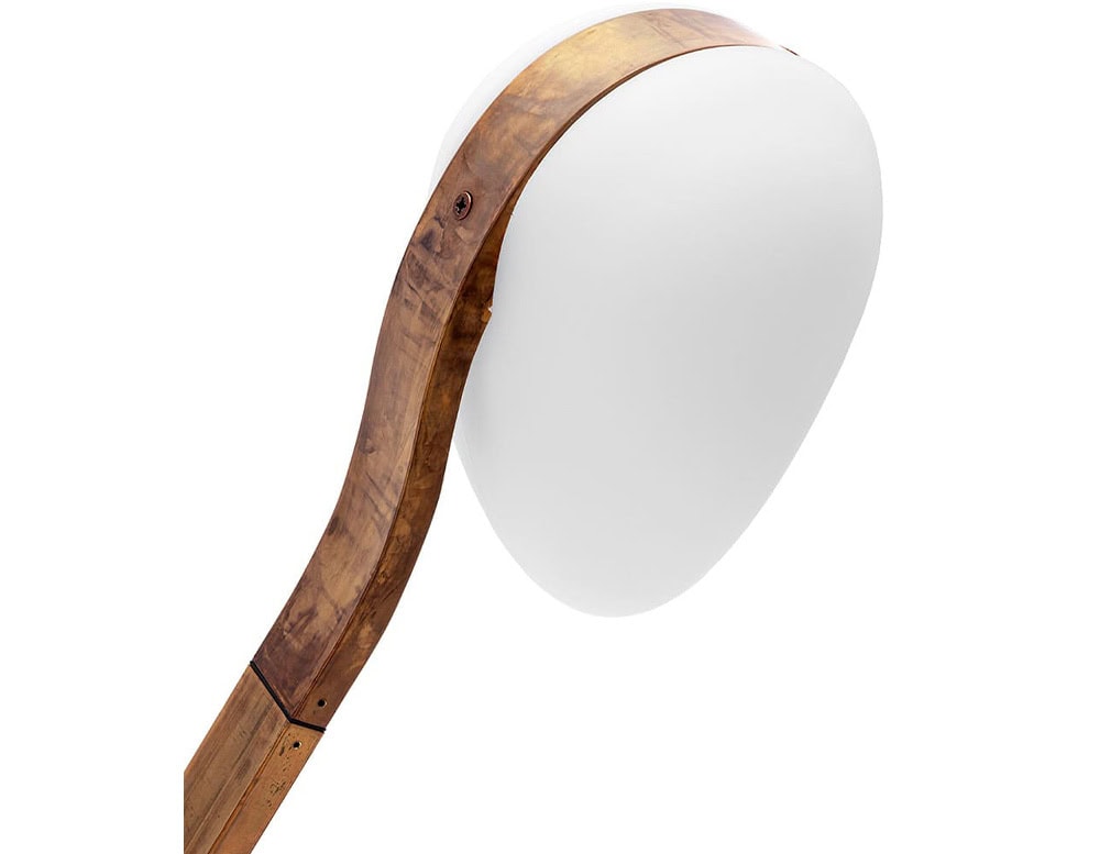 A detailed close-up of the 10th Tree Light Outdoor Floor Light showcasing its elegantly curved wooden frame and smooth white light diffuser