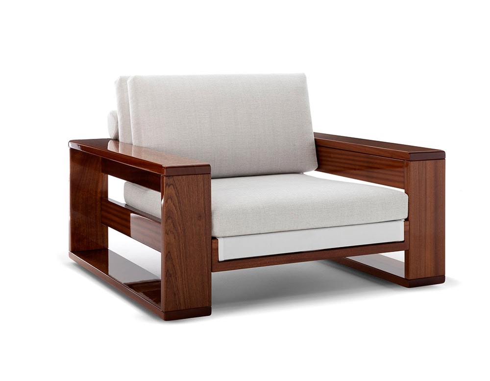 A Bellagio Outdoor Armchair with a dark wood frame and white cushions is shown at a slight angle against a white background