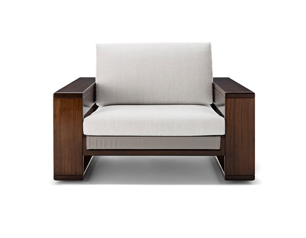 A front view of the Bellagio Outdoor Armchair showcasing its solid wooden frame plush light-colored cushions and sophisticated modern design