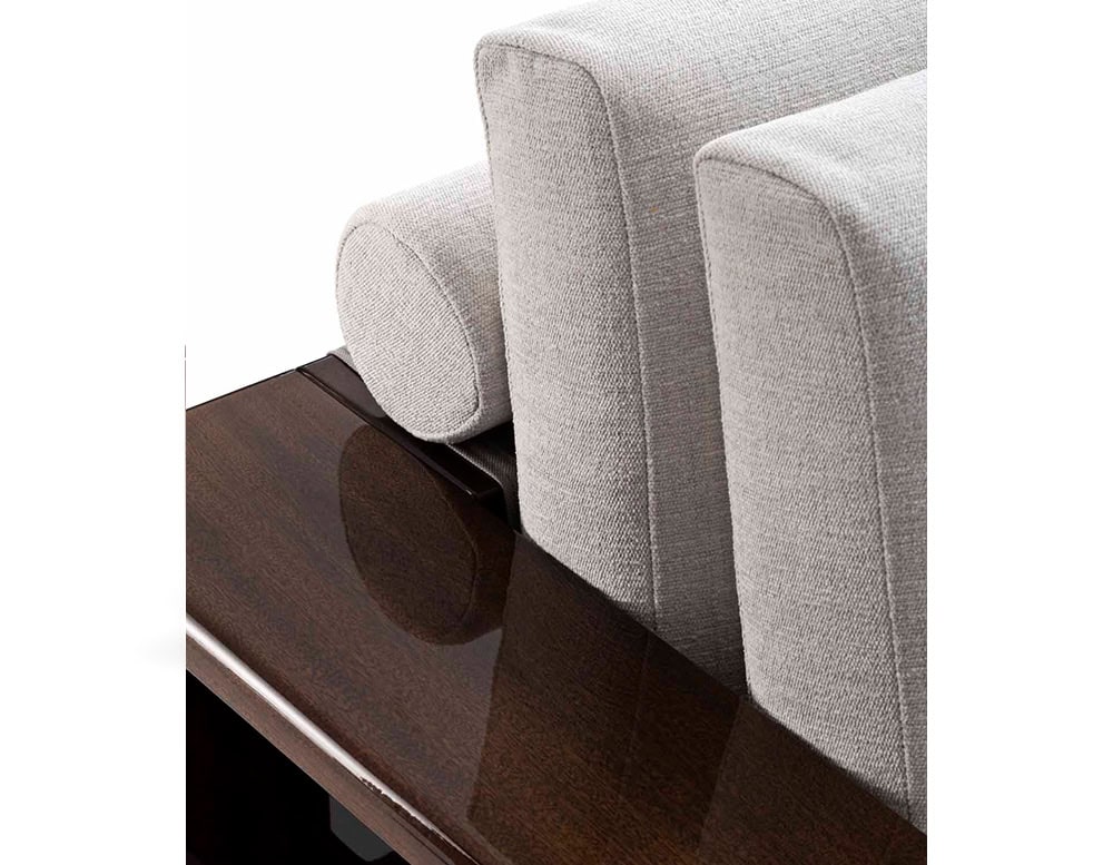A detailed close-up of the Bellagio Outdoor Armchair showcasing its plush light-colored cushions sleek wooden frame and refined craftsmanship