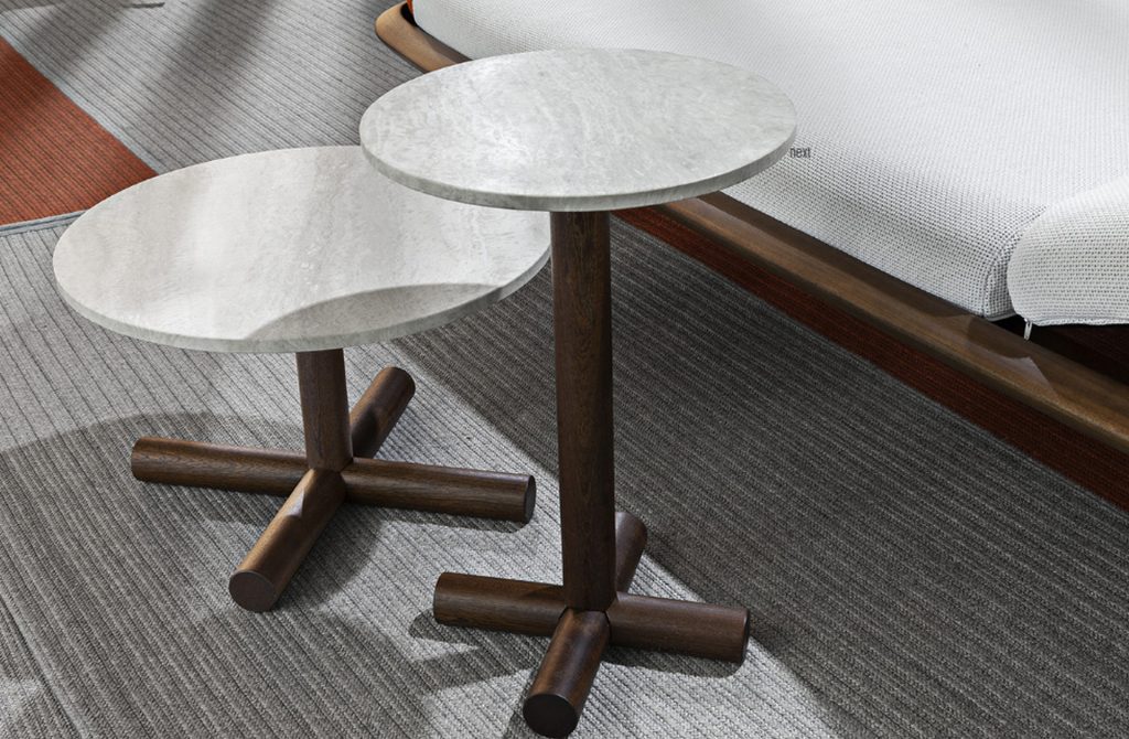 Two Helix Coffee Tables: White round top and bronze central leg on a gray background.