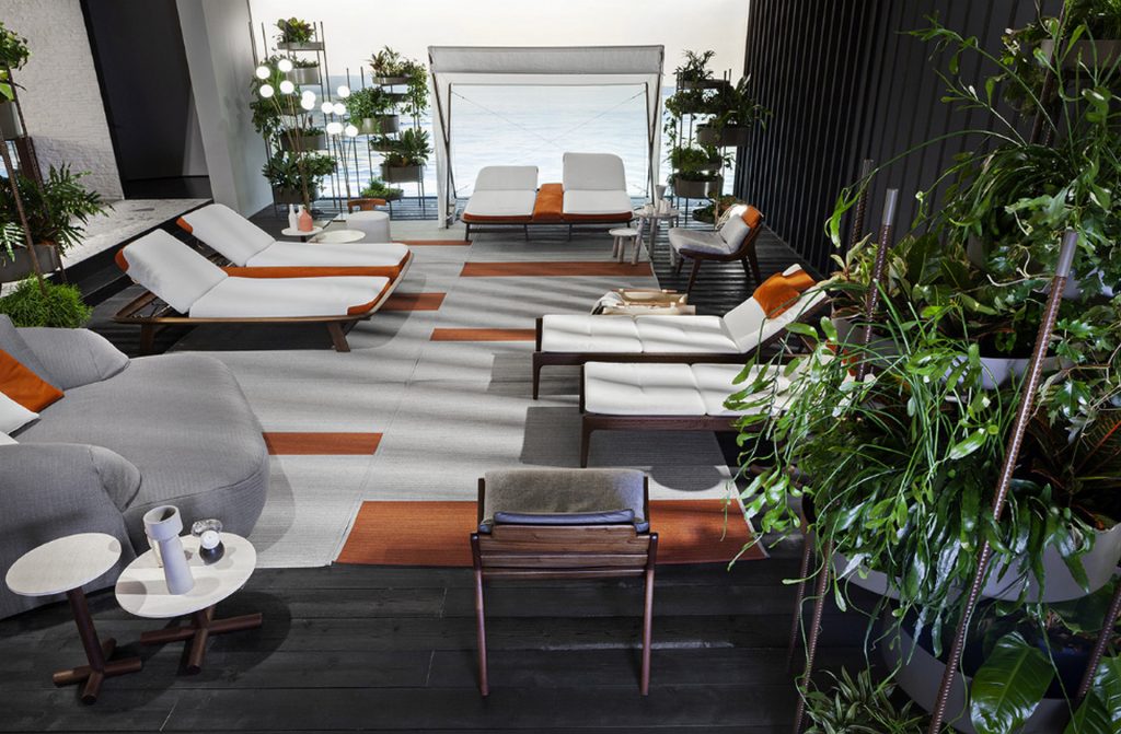 Two Helix Coffee Tables: White round top and bronze central leg in a living room.