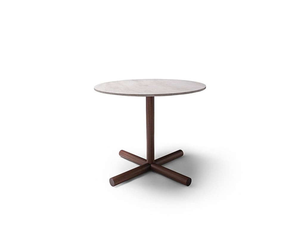 A Helix Outdoor Coffee Table with a round white top and a dark wood base with four legs is shown against a white background