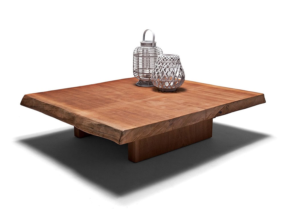 A studio shot of the Individual Outdoor Coffee Table featuring a solid wood design with a natural finish sturdy base and decorative accents