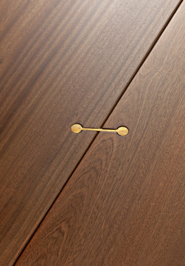Closeup of brown Joint Rectangular Coffee Table: Rectangular top.