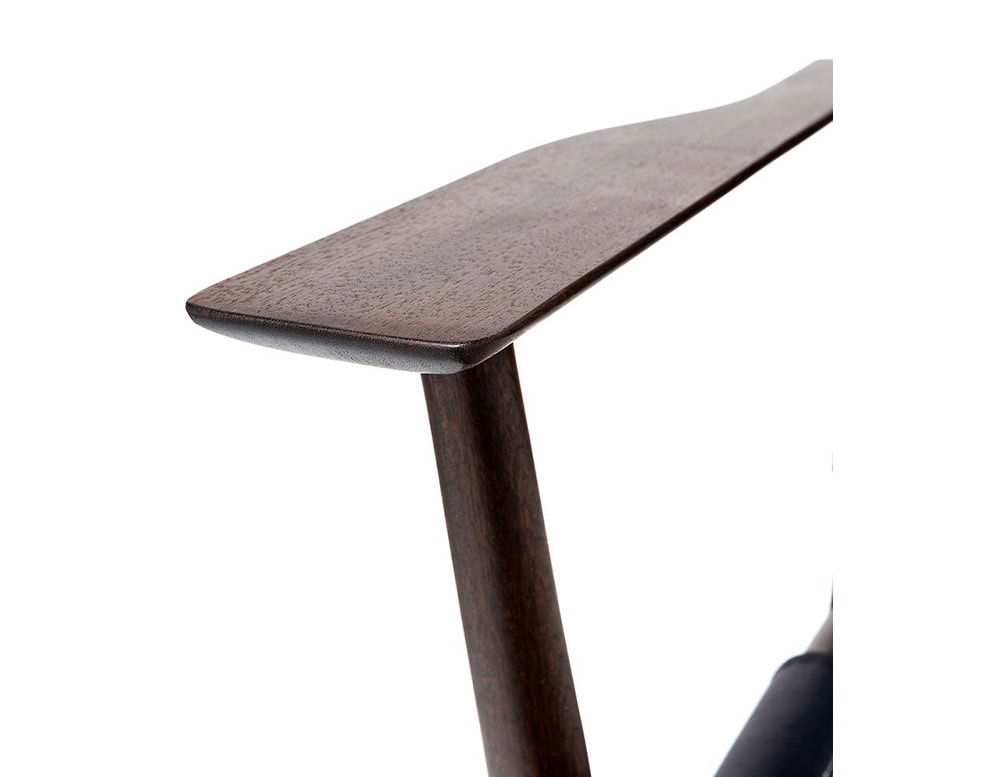 Closeup of Levante Chair. Structure in brown wood on a white background.