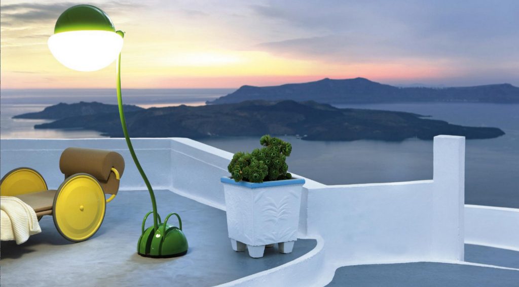 locus solus lamp in green on a terrance that has an ocean view