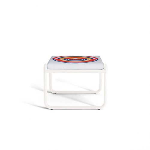 Locus Solus Pouf 1964. Structure in white upholstered in multicolored circle like pattern fabric on a white background.