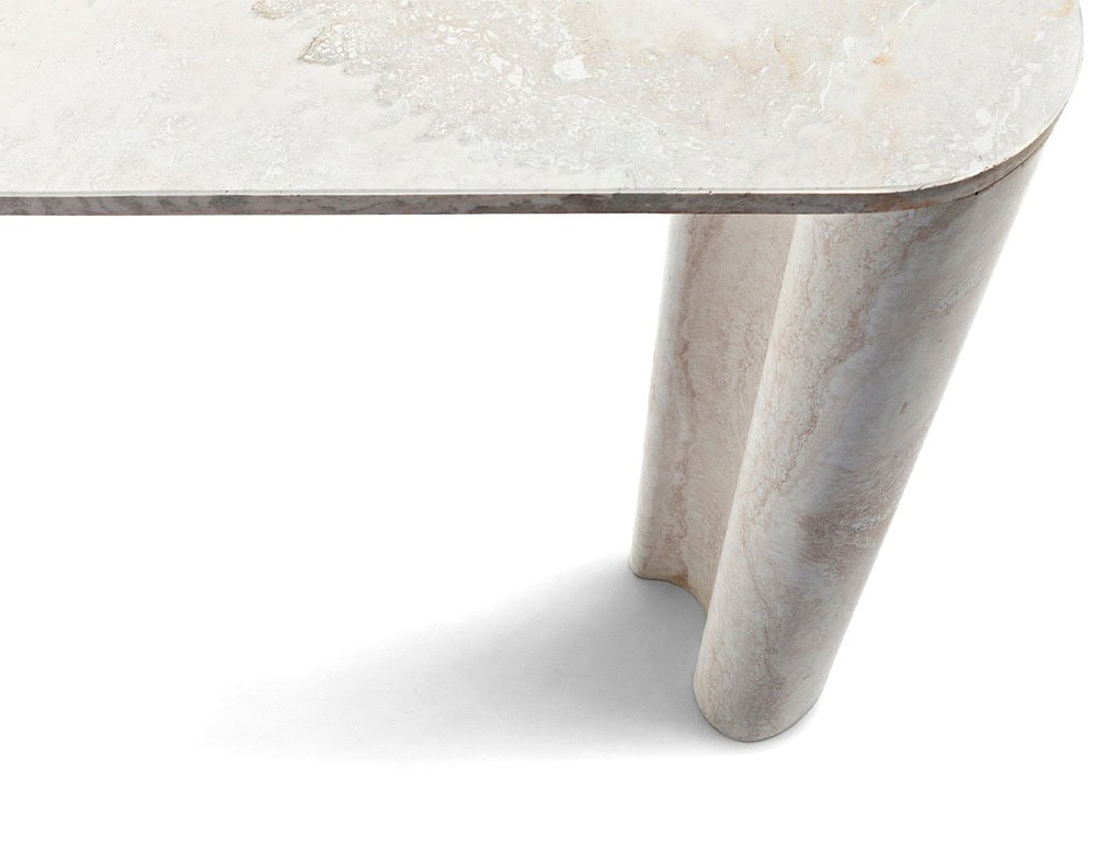 A Michaelangelo Dinner Table shows a white tabletop corner with fluted legs against a white background