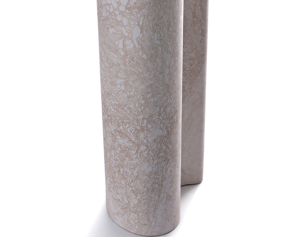 A close-up of a Michaelangelo Dinner Table shows a white table leg with a fluted design against a white background