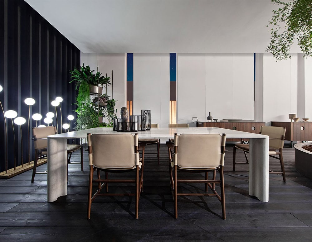 Michelangelo Dinner Table in rectangular shape. Top in white with gour gray legs in a dining room.