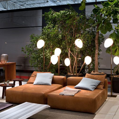 Two Montecarlo Chaise Longues with backrest. Upholteres in brown fabric in a living room.