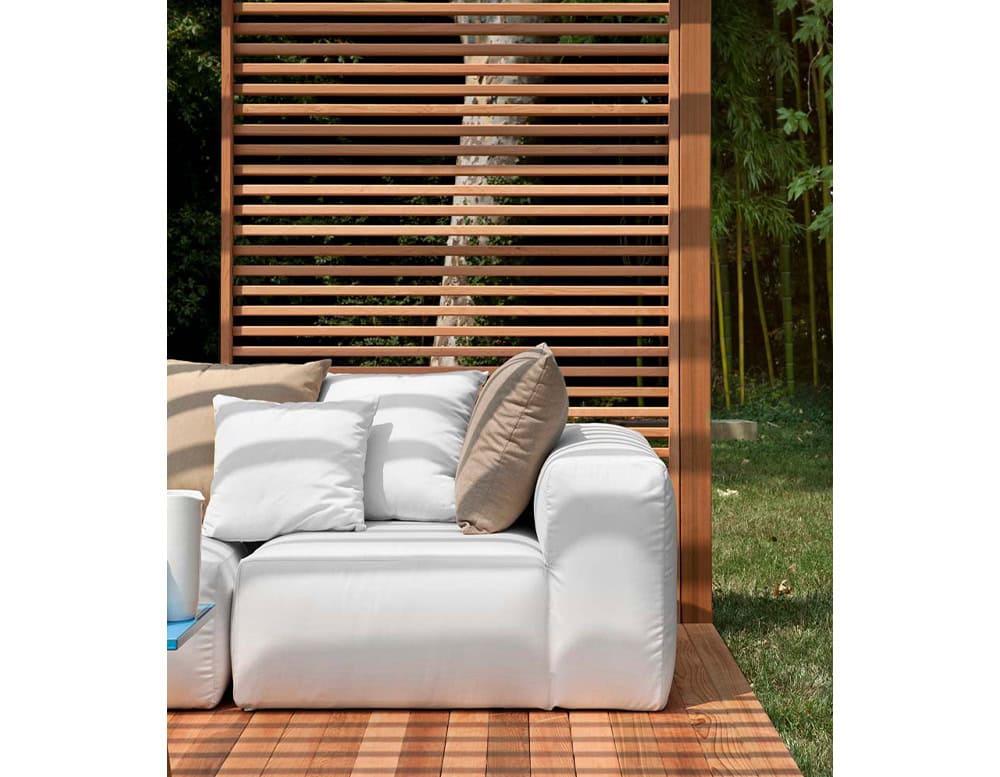 Montecarlo Lounge sofas with backrest and armrest in white fabric on a terrace.