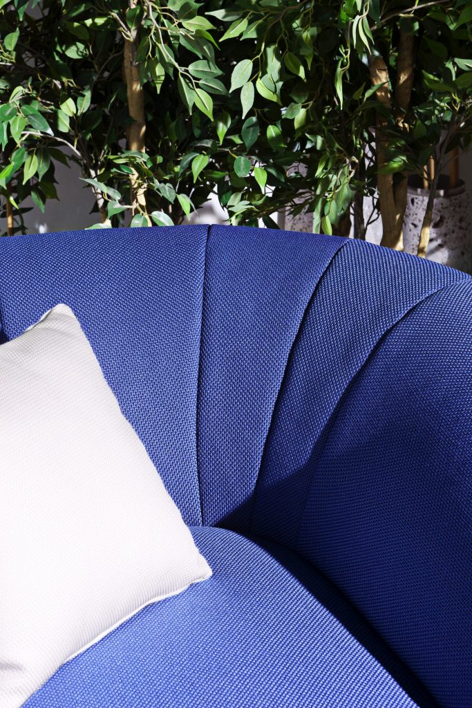 close up of the palau armchair showcasing the welt of the chair