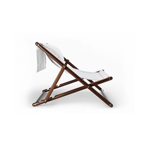 Paraggi chair with crossed legs made of brown wood, upholstered in white fabric on a white background.