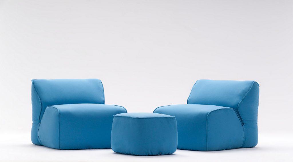 stone pouf in blue with a small pouf table in blue also
