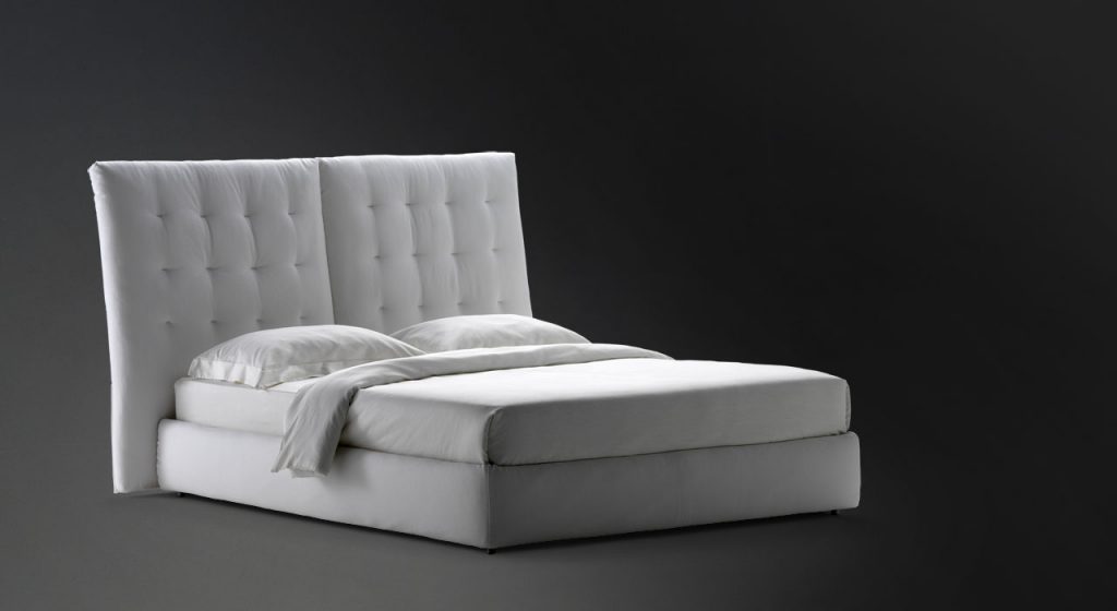 white angle quilted headboard with white sheets