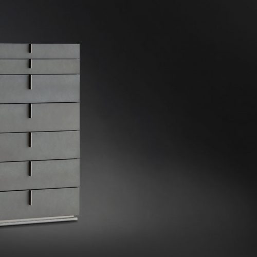 Ari Tallboy in black wood and silver handles with seven drawers on a black background.
