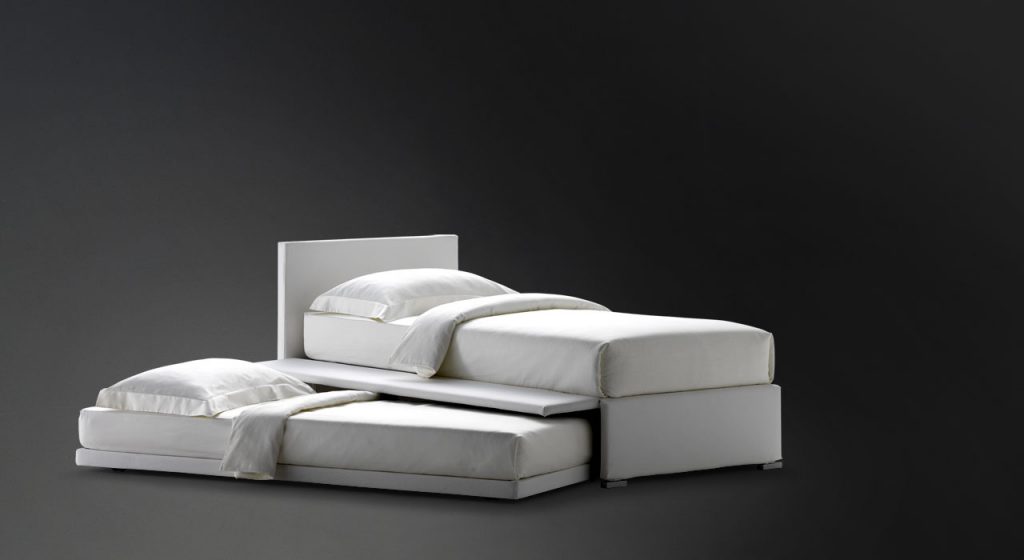White Biss bed and base with one side which can be opened and used to contain the second bed on a black background.