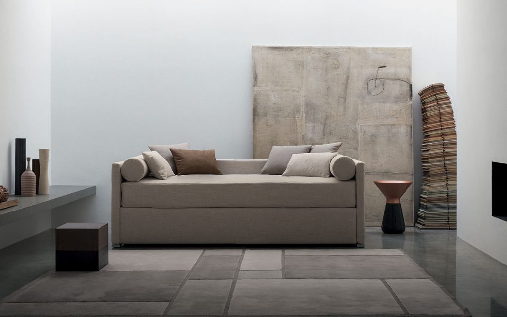 Beige Biss bed and base with one side which can be opened and used to contain the second bed in a living room.