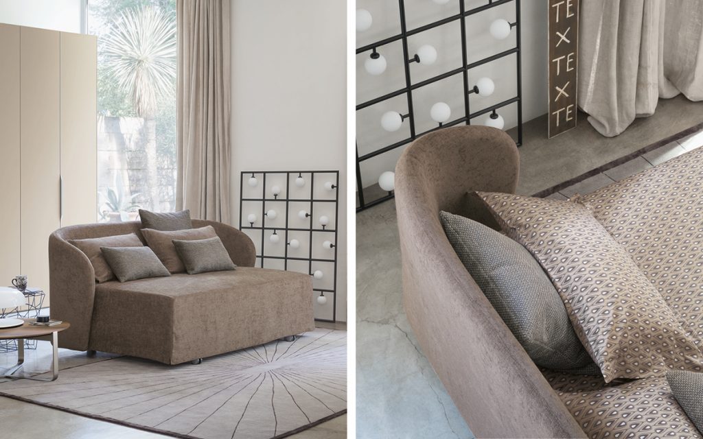 Two Celine Sofa Sleepers in brown. Bed top, pillows and wheels in a bedroom.