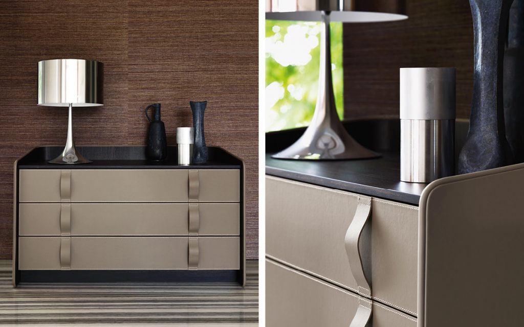 Closeup of Gentleman Dresser Low. Curved black wood with cover and shelfs in brown in a bedroom.
