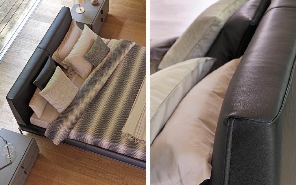 Closeup of Icon bed. Base and heardboard padded in black leather with black steel legs in a bedroom.