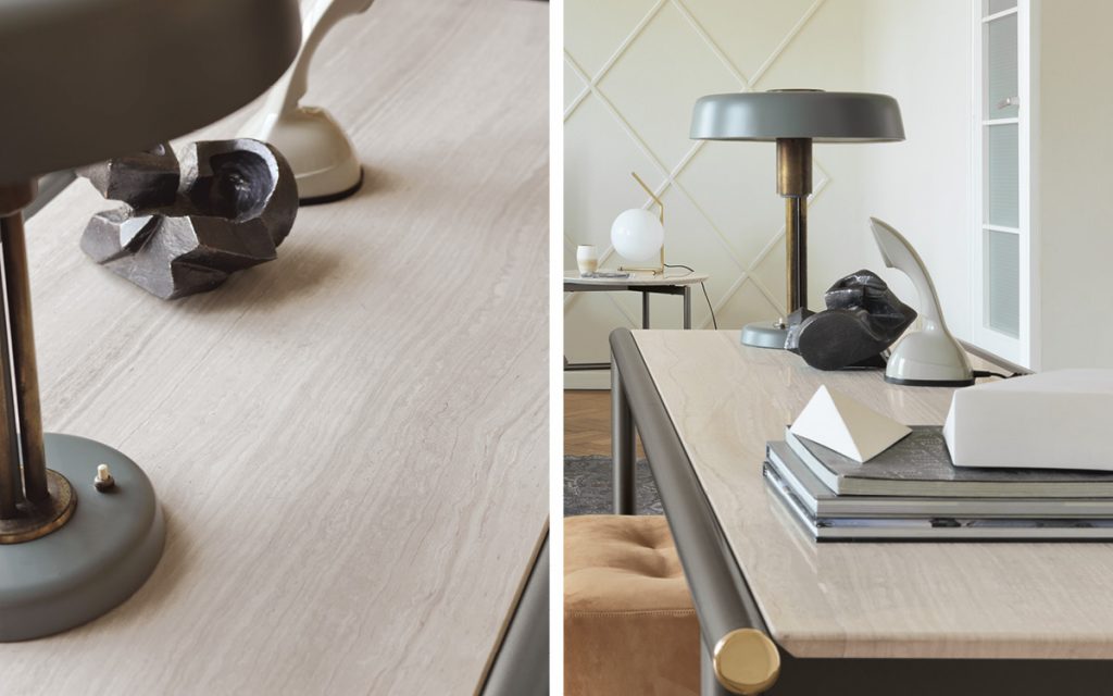 Closeup of Rectangular Iko. Beige top with a brown drawer below and gray legs in a study room.