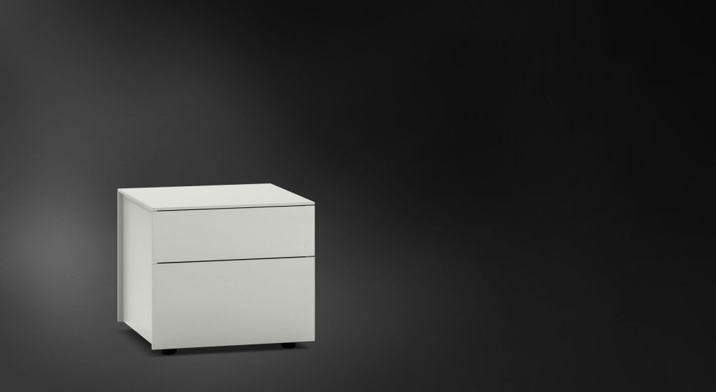 Juta Dresser with two drawers in white color on a black background.