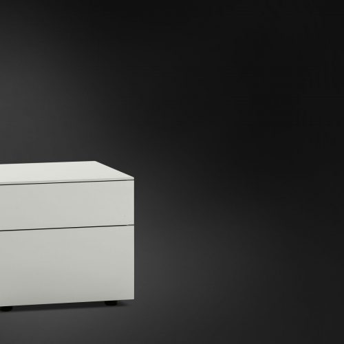 Juta Night Table with two drawers of different sizes in white on a black background.
