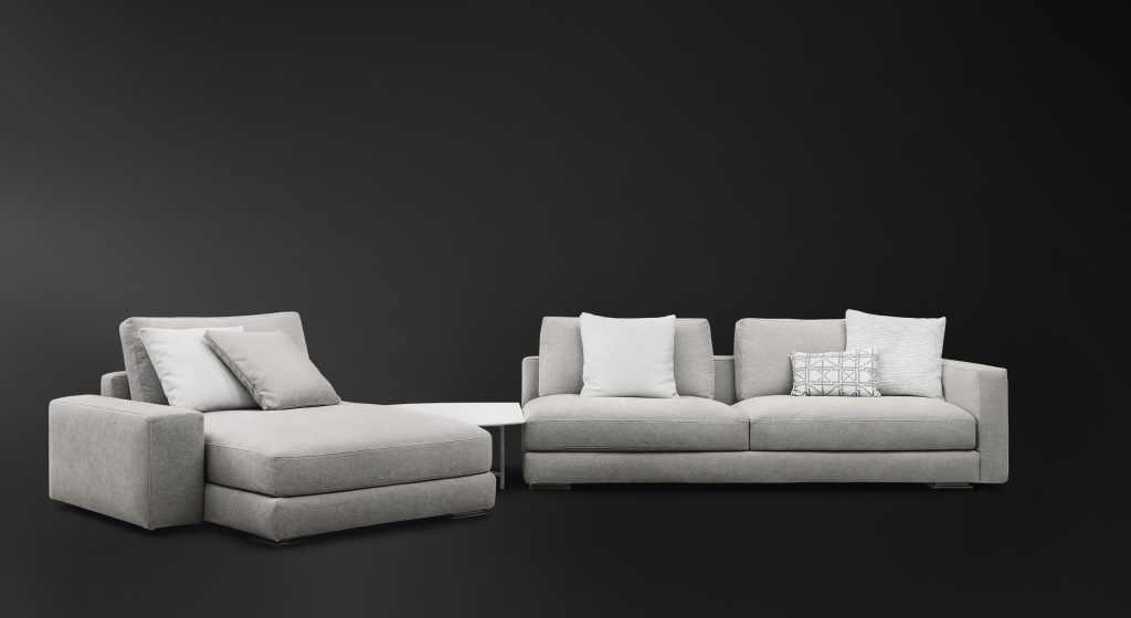 Myplace A: White modular sofa, one seat on left, two on right, on a black background.