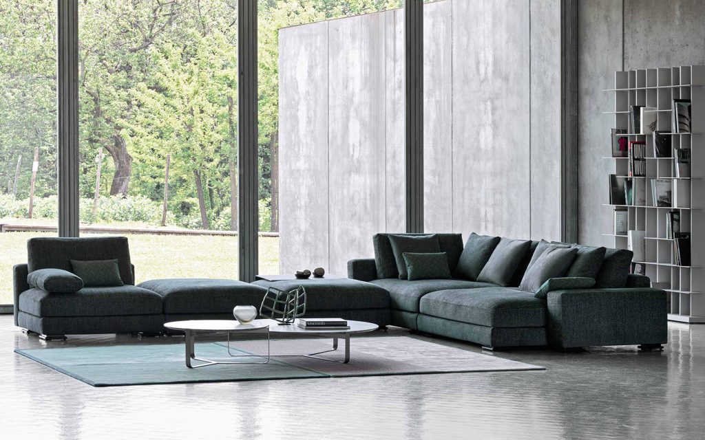 Myplace A: L shaped green modular sofa with black legs, in a living room setting.