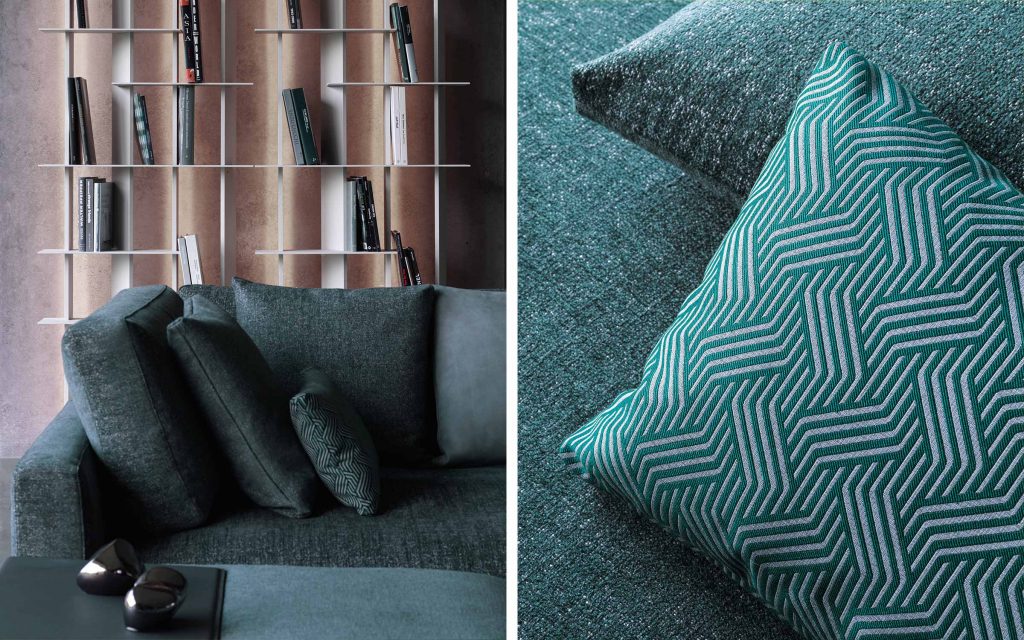 Closeup of Myplace A: L shaped green modular sofa with black legs, in a living room setting.