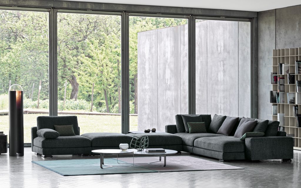 Myplace A: L shaped green modular sofa with black legs, in a living room setting.