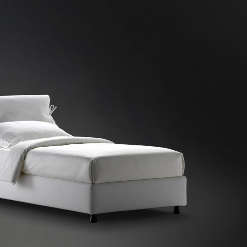 Nathalie Single bed white headboard cushions and gray base with black legs on a black background.