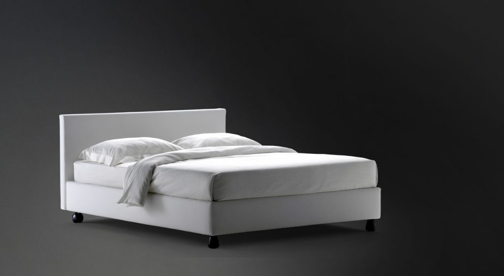 Notturno 2 Double bed. Base and backrest covered in gray fabric on a black background.