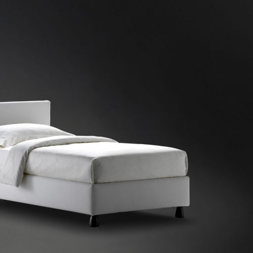 Notturno 2 Single bed. Base and backrest covered in gray fabric on a black background.