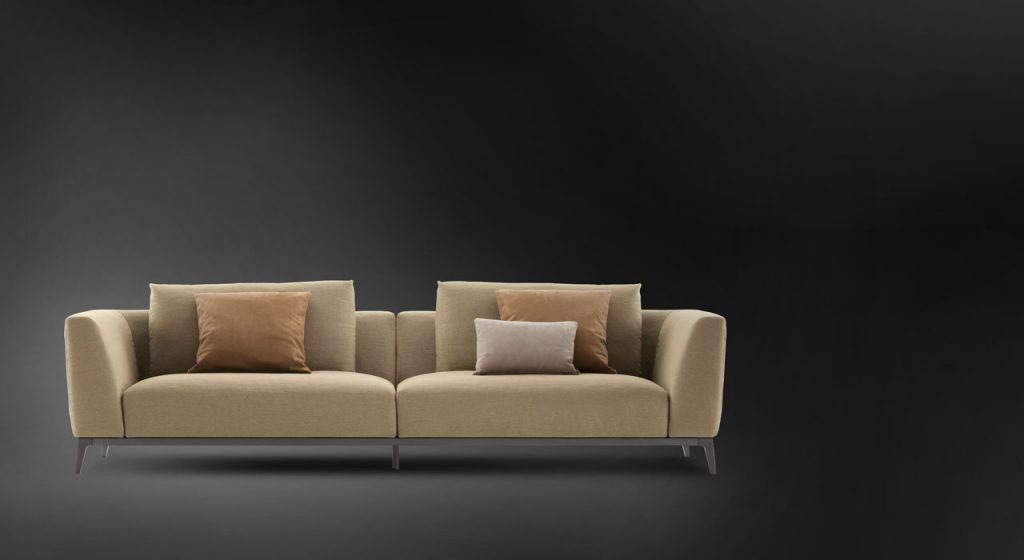 Olivier C sofa upholstered in brown fabric and four legs in steel on a black background.