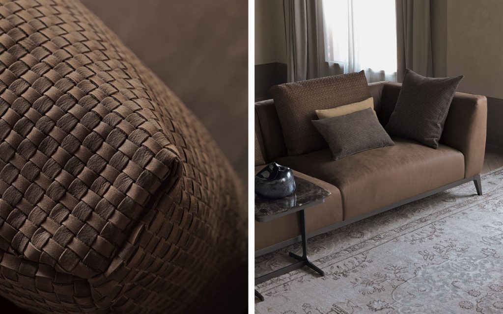 Closeup of Olivier C sofa upholstered in brown fabric and four legs in steel in a living room.
