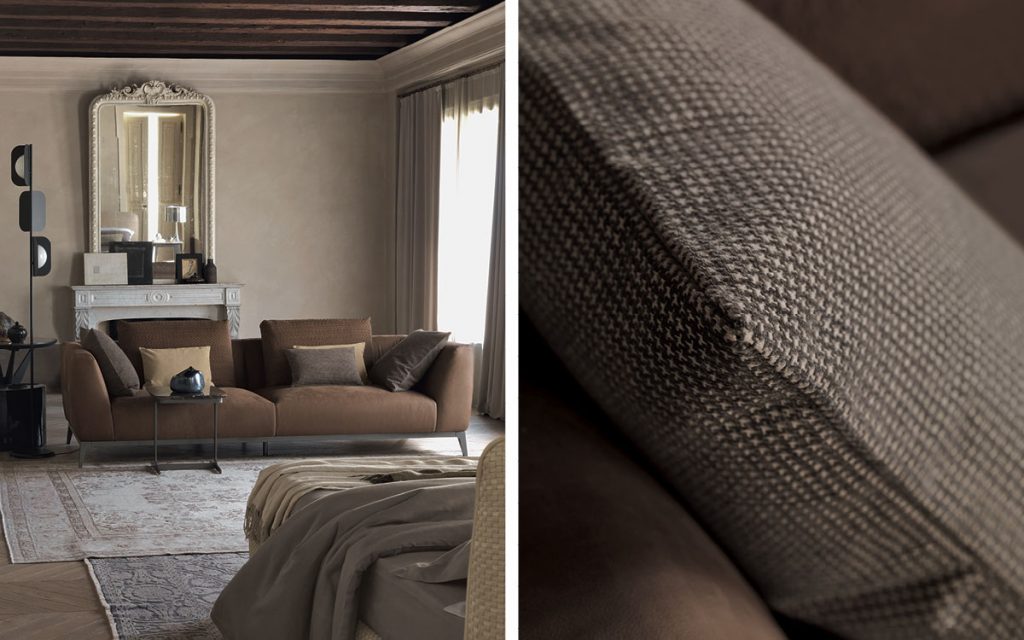 Closeup of Olivier C sofa upholstered in brown fabric and four legs in steel in a living room.