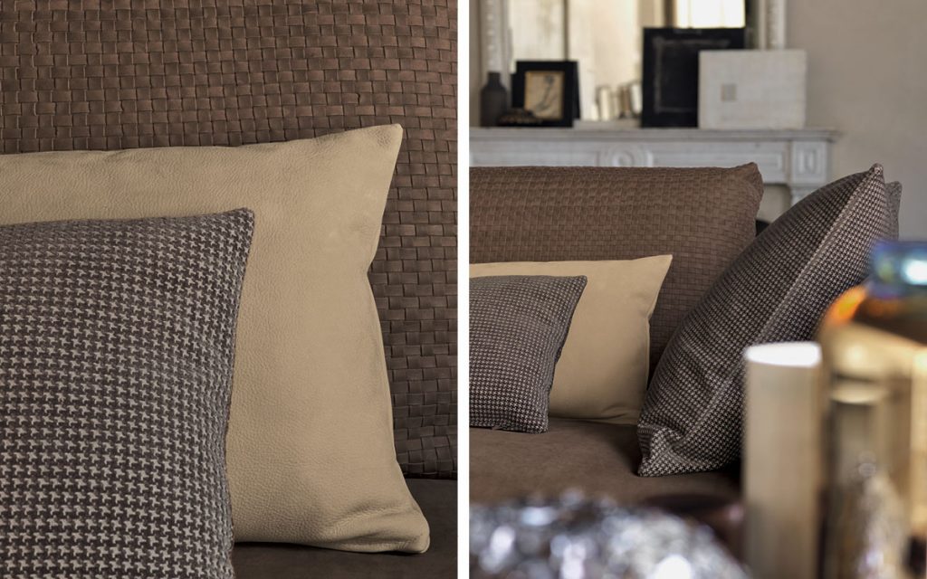 Closeup of Olivier C sofa upholstered in brown fabric and four legs in steel in a living room.