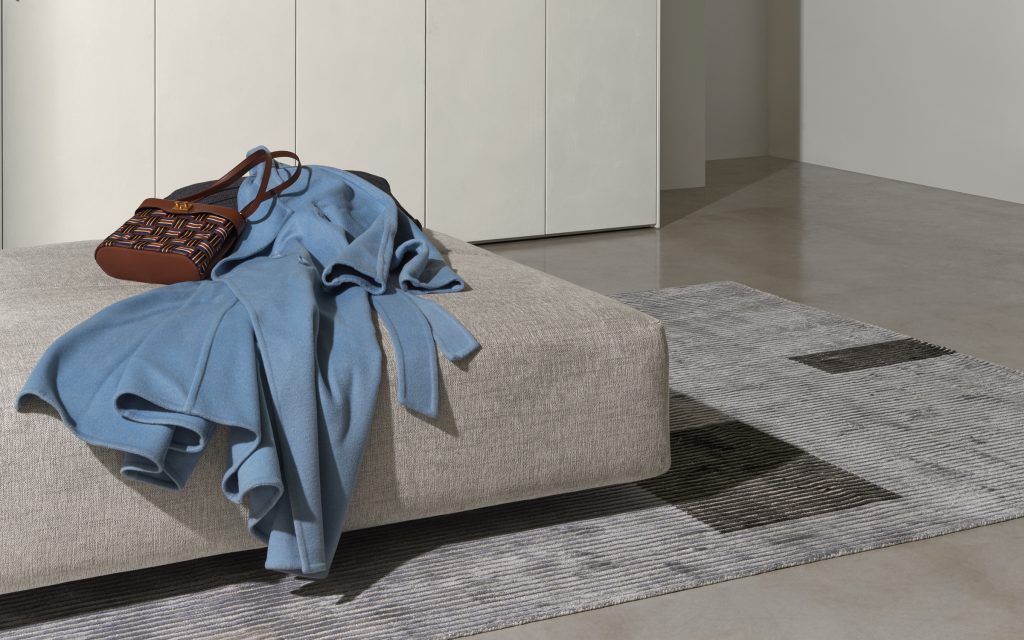 Softbench one hundred fifty gray wide square modular sofa in a living room.